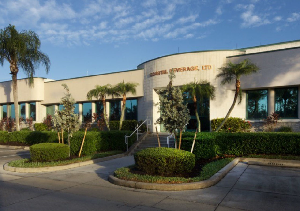 Exterior View with Palm Trees of Coastal Beverage Distribution Facility Built by ARCO Construction in Naples