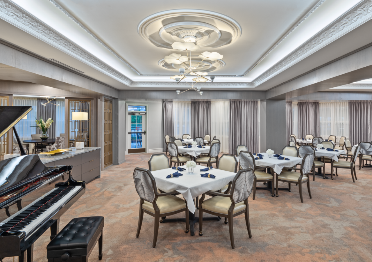 Elegant Dining Room with Piano at Stonecrest Senior Living at the Plaza Built by ARCO Living Group