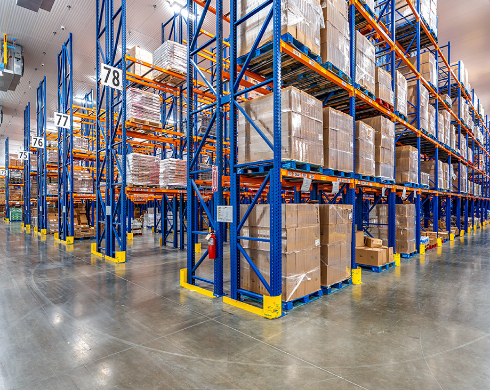 Racking with pallets of product on the shelves inside a Cold Storage Facility renovation in Rancho Cucamonga, CA