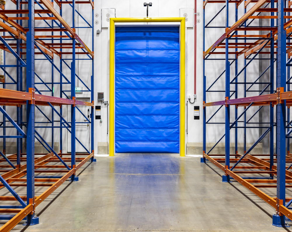 Empty racking and dock door for the WCS Cold Storage Facility in Winchester, WV