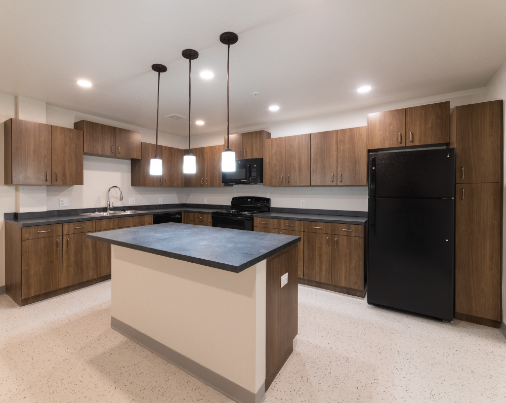 kitchen area wihtin a unit of the landmark 301 independent living facility in conroe texas