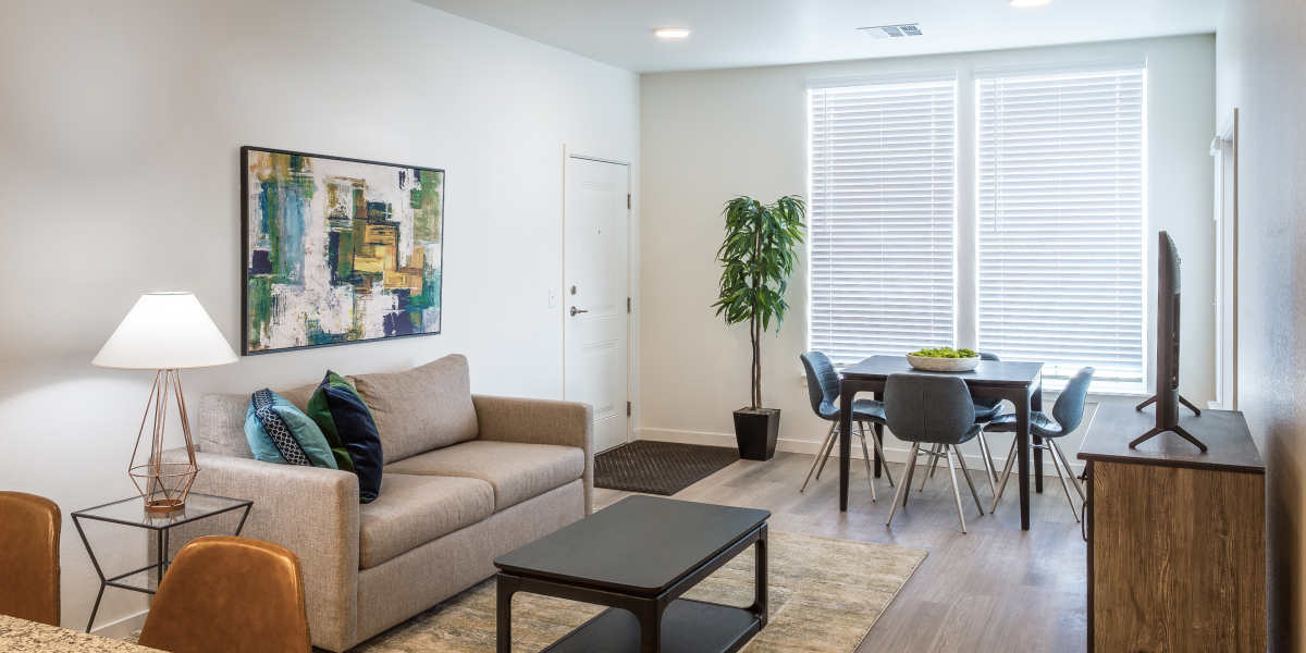 living room within a unit of the reserves at eagle point affordable housing community in aurora colorado