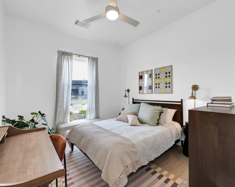 bedroom of a first street flats apartment unit in rodgers arkansas